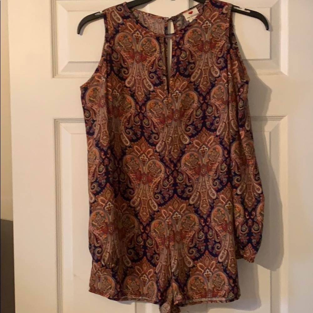 Long sleeve open shoulder romper.